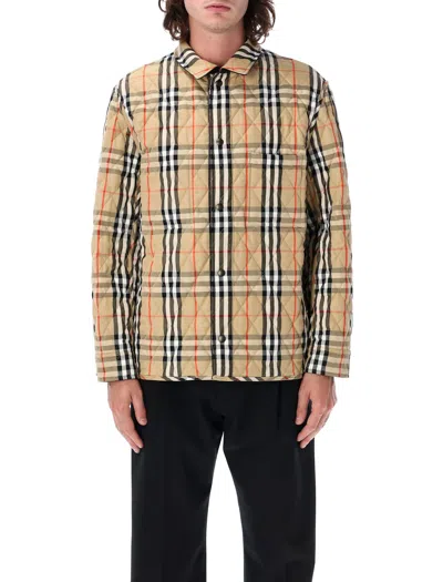 Shop Burberry Reversible Quilted Nylon Overshirt In Black/sand Ip Check