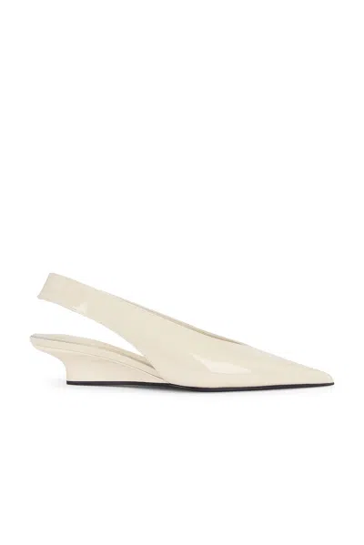 Totême The Wedge-heel Leather Slingback Pumps In Bleached Sand