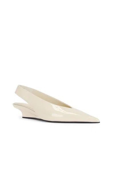 Totême The Wedge-heel Leather Slingback Pumps In Bleached Sand