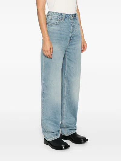 Essentials Embossed Patch Denim Jeans In Blue