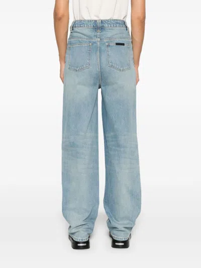 Essentials Embossed Patch Denim Jeans In Blue
