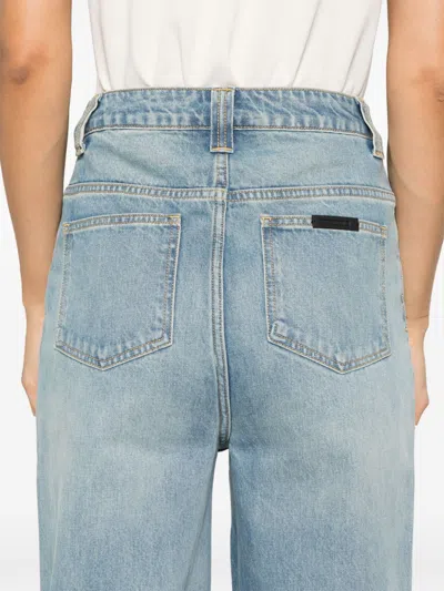 Essentials Embossed Patch Denim Jeans In Blue