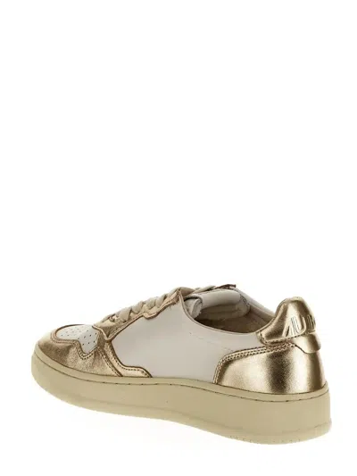 Shop Autry Low Sneakers In Oro