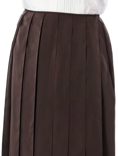 Shop Jw Anderson Ribbon Hem Pleated Midi Skirt In Chocolate Brown