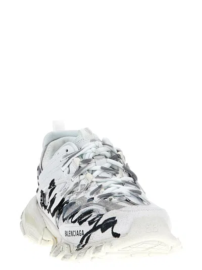 Shop Balenciaga Track Sneakers In White/black