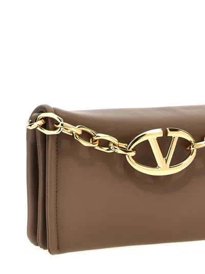 Shop Valentino Garavani Vlogo Chain Clutch Bag In Brown