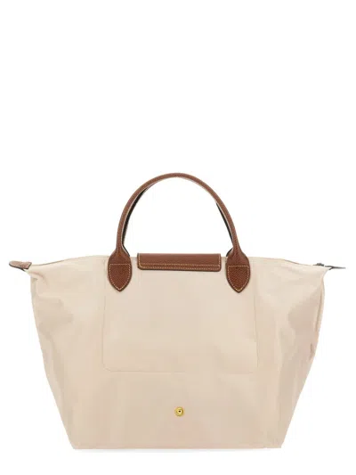 Shop Longchamp Le Pliage Medium Bag In White