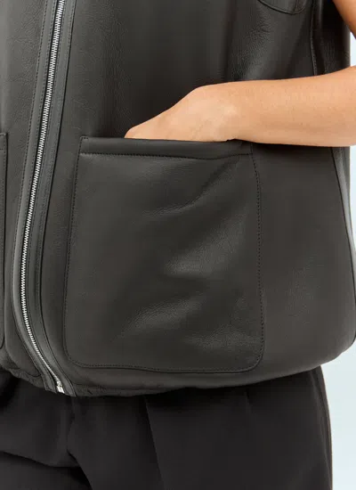 Gucci Reversible Shearling Vest In Black