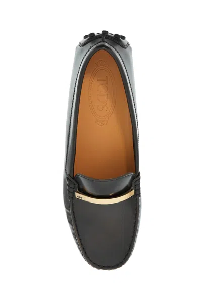 Tod's Loafers With Golden Detail And Gommino Sole In Brown