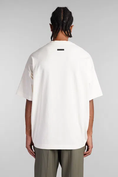 Shop Fear Of God T-shirt In Beige