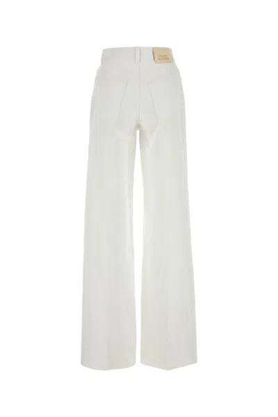 Alexander Mcqueen Logo-plaque Jeans In Opticalwhite