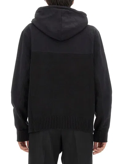 Alexander Mcqueen Drawstring Hooded Sweater With Ribbed Hem And Cuffs In Black