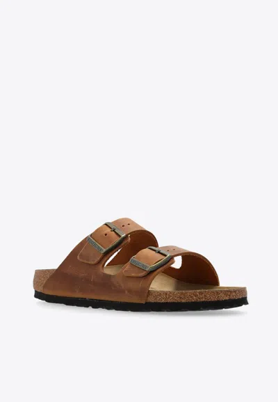 Birkenstock Arizona Two-strap Leather Slides In Brown