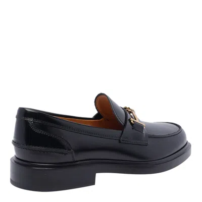 Tod's Loafers With Clamp And Oval Logo Shoes In Black