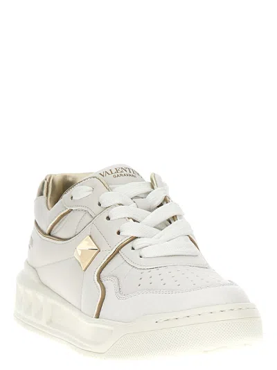 Valentino Perforated Leather Studded Sneakers In Gold