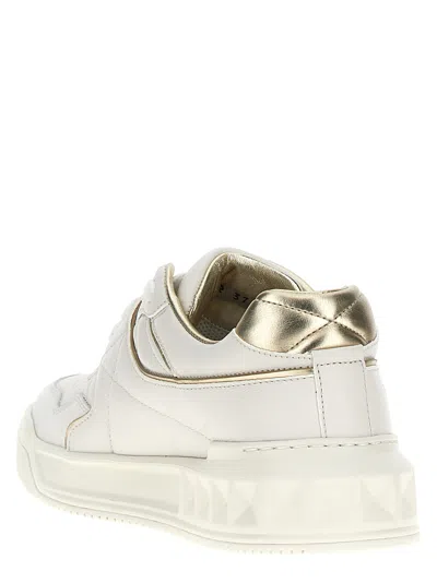 Valentino Perforated Leather Studded Sneakers In Gold