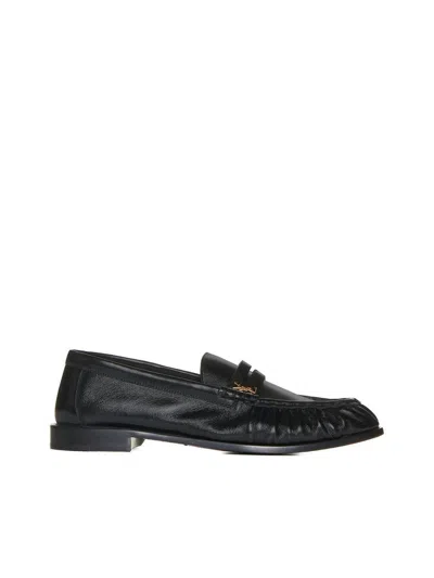 Saint Laurent Leather Loafer With Metal Monogram On The Front In Black