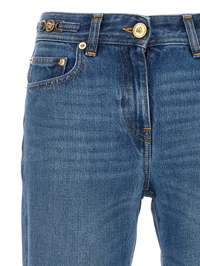Versace Cotton Bootcut Denims With Logoed Morsets 32cm In Blue