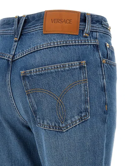 Versace Cotton Bootcut Denims With Logoed Morsets 32cm In Blue