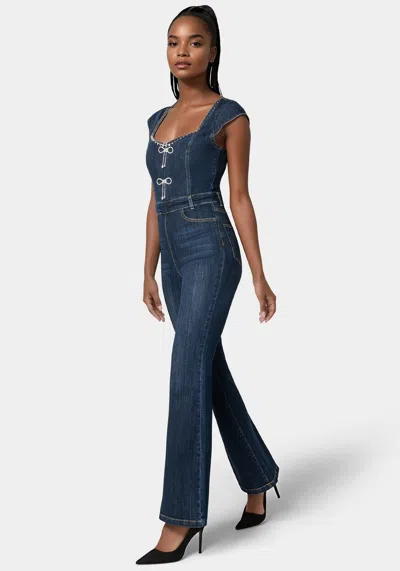 Bebe Embellished Neckline Flared Leg Denim Jumpsuit In Dark Indigo Wash