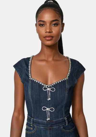 Bebe Embellished Neckline Flared Leg Denim Jumpsuit In Dark Indigo Wash