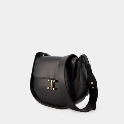 Ines De La Fressange Sleek And Timeless Senda Shoulder Handbag In Camel Leather