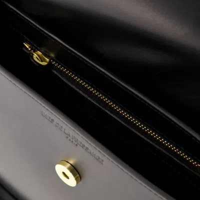 Ines De La Fressange Sleek And Timeless Senda Shoulder Handbag In Camel Leather