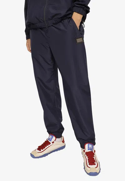 Dolce & Gabbana Logo Track Pants In Tech Fabric In Blue