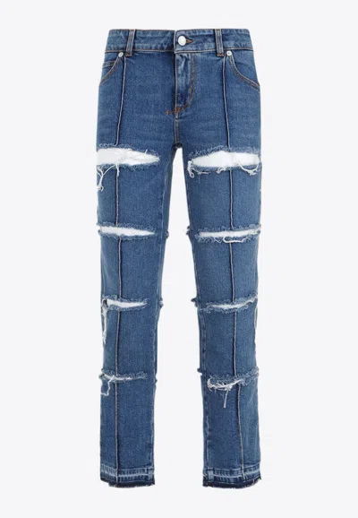 Alexander Mcqueen Low-rise Distressed Jeans In Blue