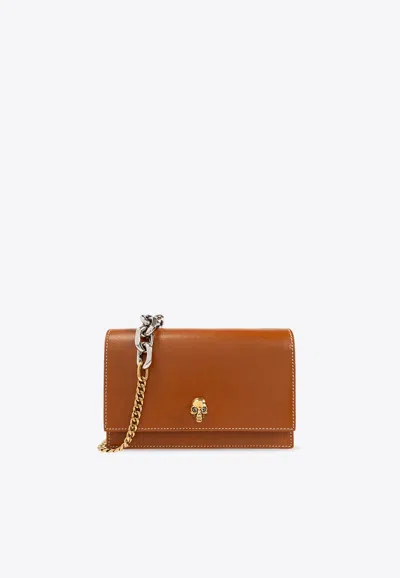 Alexander Mcqueen Small Skull-plaque Leather Crossbody Bag In Brown