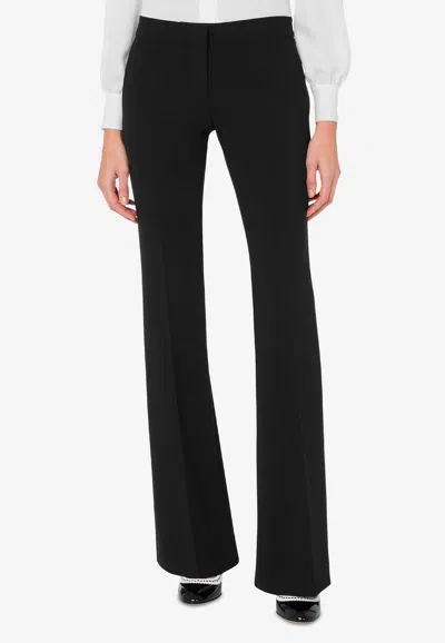 Moschino Flared High Waist Trousers With Front Crease In Black