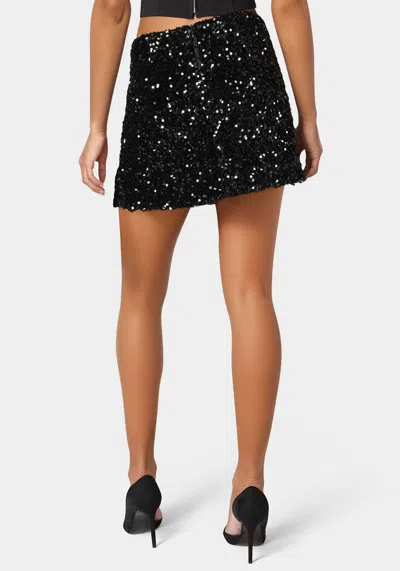 Bebe Mini Sequin Ruffle Slit Skort In Black
