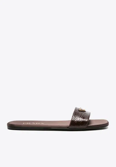 Prada Triangle-logo Embossed-crocodile Slides In Brown