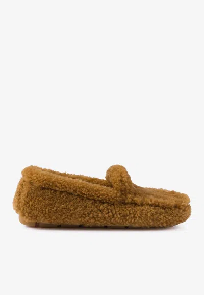Prada Triangle Logo Shearling Loafers In Caramel