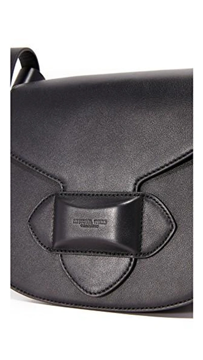 Shop Michael Kors Daria Small Cross Body Saddle Bag In Black