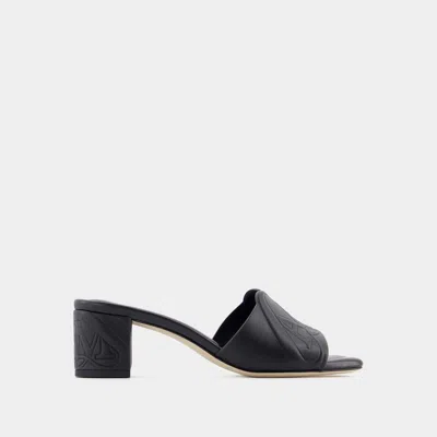 Alexander Mcqueen Black Slip-on Sandals With Embossed Logo In Padded Leather Woman