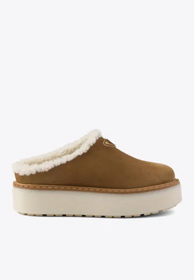 Prada Brown Suede Mules With Shearling Trim And Plush Lining In Blue