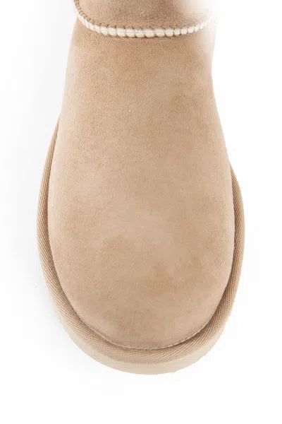 Ugg 10mm Classic Ultra Mini Shearling Boots In Beige