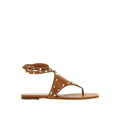 Shop Valentino Rockstud Flat Sandals In Brown