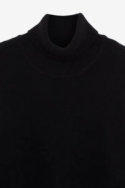 C.p. Company Ribbed Knit Roll Neck Sweater With Signature Lens Detail And Zip Pocket In Black