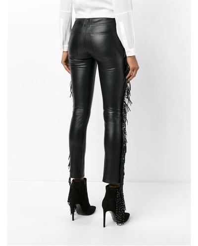 Shop Saint Laurent Fringed Leather Trousers