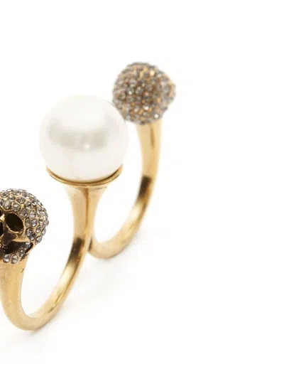 Alexander Mcqueen Gold-tone Double Ring With Crystal Embellished Skulls And Pearl In Brass