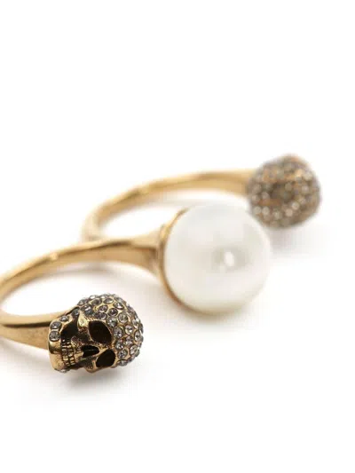 Alexander Mcqueen Gold-tone Double Ring With Crystal Embellished Skulls And Pearl In Brass