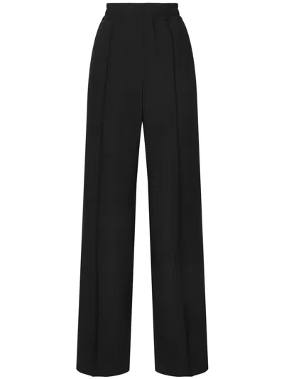 Dolce & Gabbana Flared Wool Jacquard Pants With Dg Logo In Black