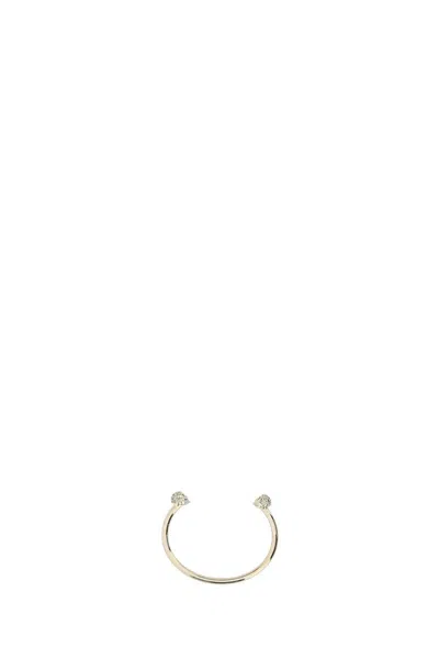 Alexander Mcqueen Women Gold Metal Twin Skull Bracelet In 0953greige