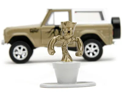Diecast Model Jada 1973 Ford Bronco Gold Metallic With White Top And Groot Diecast Figure "guardians Of The Galaxy" "ma