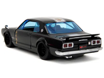 Diecast Model Jada 1971 Nissan Skyline Gt-r Rhd (right Hand Drive) Black With Silver Stripe And Mikey Diecast Figure "t