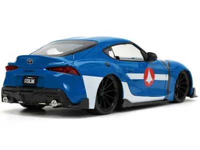 Diecast Model Jada 2020 Toyota Supra Blue With Graphics And Max Sterling Diecast Figurine "robotech" "hollywood Rides"