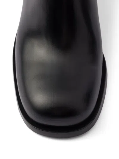 Prada Brushed Leather Ankle Boots In Black