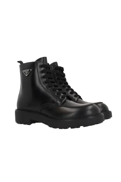 Prada Logo-plaque Panelled Ankle Boots In Black